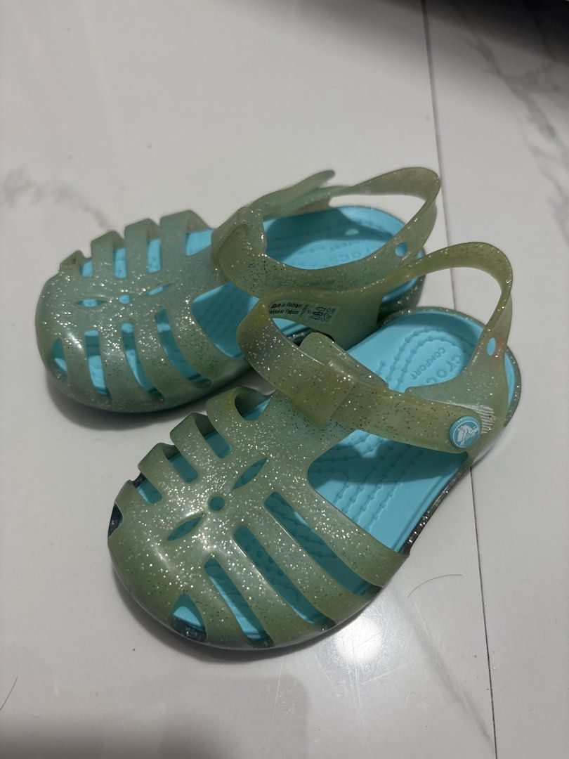 C5 (12cm) Crocs Glitter Jelly (Category: Babies & Kids Fashion) located in Cavite. Submitted by crisalyn___ (Listing ID 1461715099, Image 1). Description: - Cute Crocs jelly sandals for kids - Sparkly glitter detail - Translucent aqua blue color - Easy strap closure - Great for beach or pool - Soles with good grip - Please check photos for exact condition.