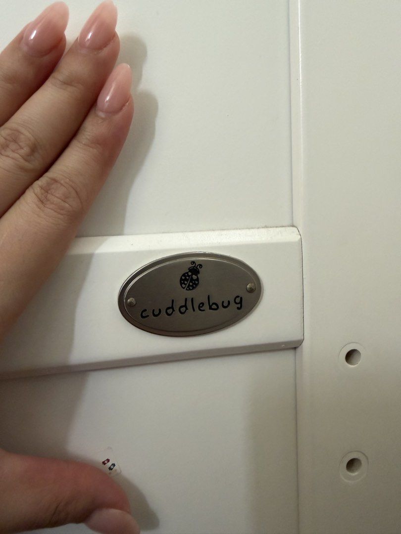 Cuddlebug Baby Cot with Mattress (Category: Cots & Cribs) located in Pasig City. Submitted by _antheaalta (Listing ID 1461649645, Image 3). Description: - Cuddlebug baby cot in white with natural wood accents - Includes mattress - Minor scuffs on wood trim from normal use - Sturdy construction - Ready for a new home -Less 1k if without foam -RFS upgraded to bigger bed.