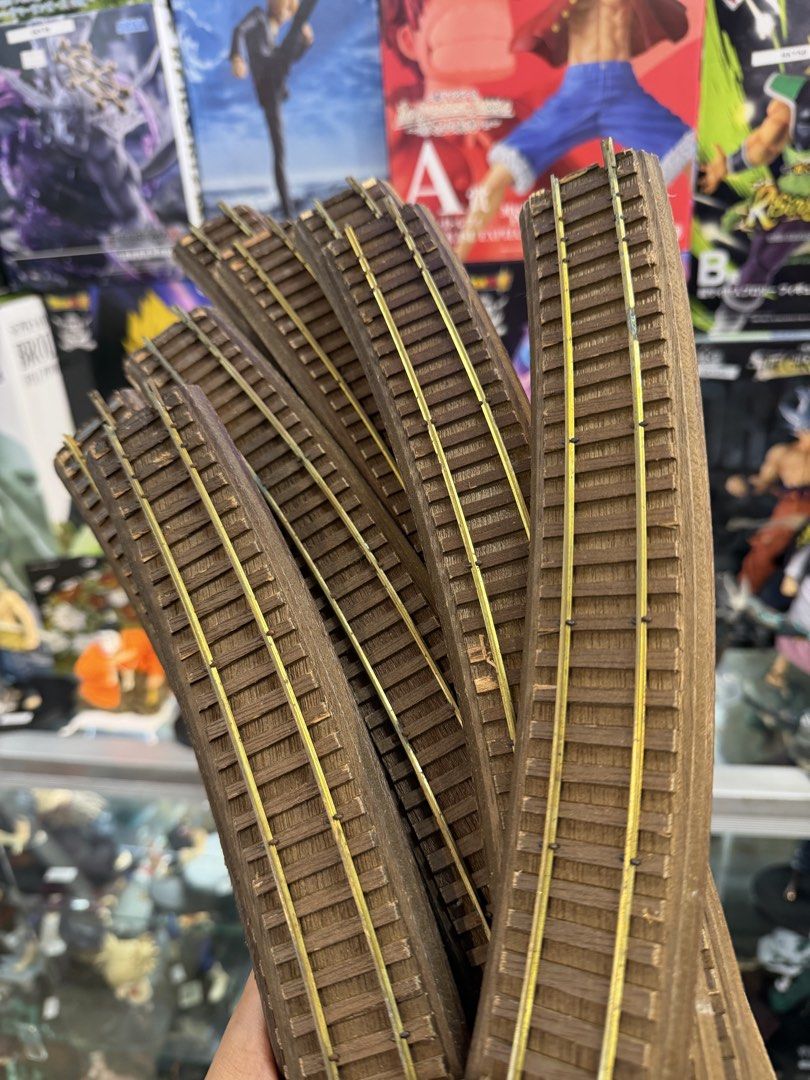 Curved Model Train Tracks Lot (Category: Vintage Collectibles) located in Makati City. Submitted by japankycollection (Listing ID 1461635603, Image 2). Description: - Bundle of curved model train tracks - Made of wood with metal rails - Ideal for building your own railway layout - Plenty of pieces included to get started - Feel free to ask any questions!.