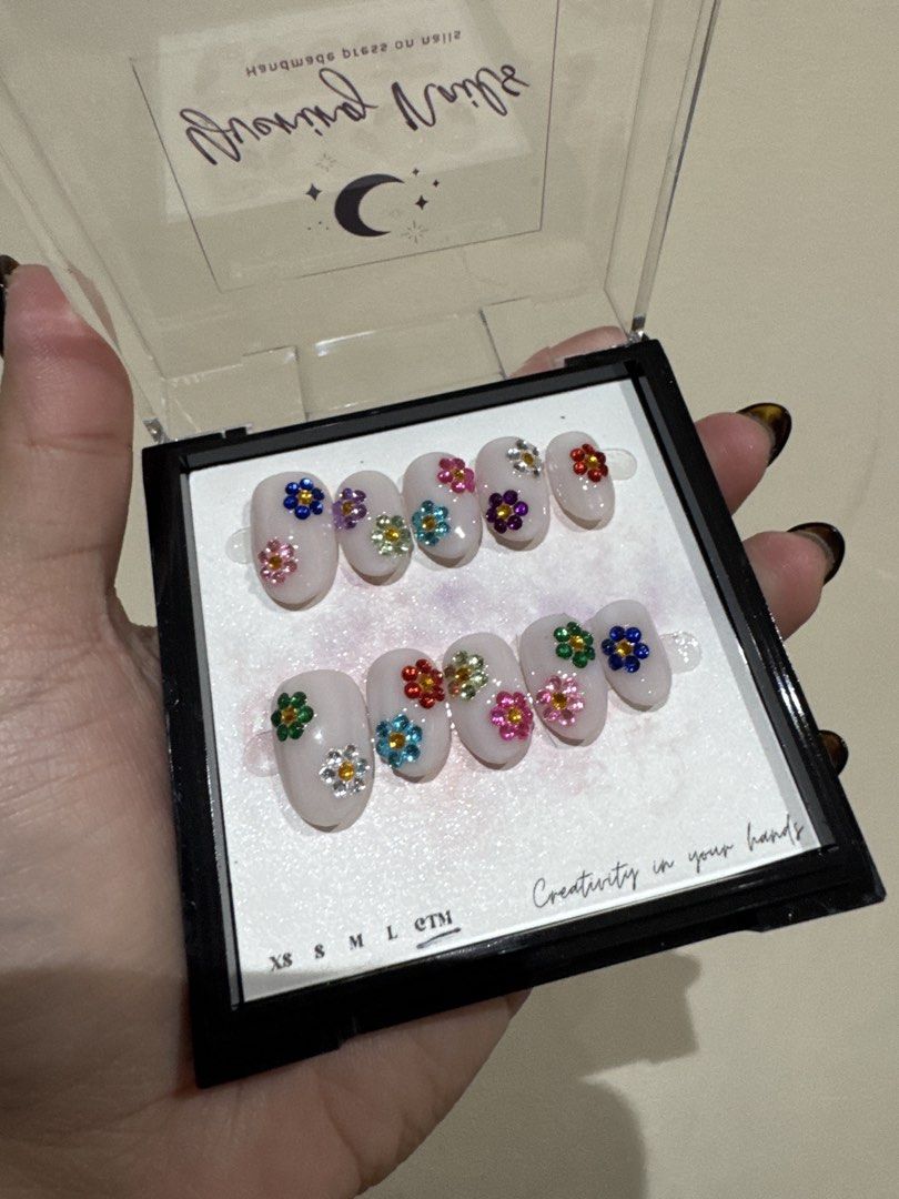 Custom Flower Press-On Nails (Category: Hands & Nails) located in Paranaque City. Submitted by scattermatter (Listing ID 1461773434, Image 2). Description: - Adorable press-on nails with charming flower gems. - Complete set. - Best fits XS 📍Location: Parañaque 💰Payment: BPI or Gcash 🚚Shipping: c/o buyer - Lalamove/J&T/LBC.