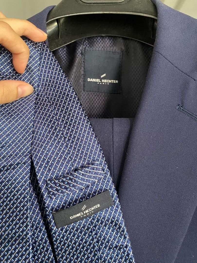 Daniel Hechter Paris Navy Blue Suit (Category: Coats, Jackets and Outerwear) located in Caloocan City. Submitted by purefalcon.974eee (Listing ID 1461604254, Image 3). Description: - Brand: Daniel Hechter Paris - Color: Navy Blue - Set Includes: Jacket and Trousers - Jacket Features: Two-button closure, includes pocket square - Trousers Style: Slim fit - Material: 70% Polyester, 30% Rayon - Size: 42 also includes Necktie and Belt with Signature B