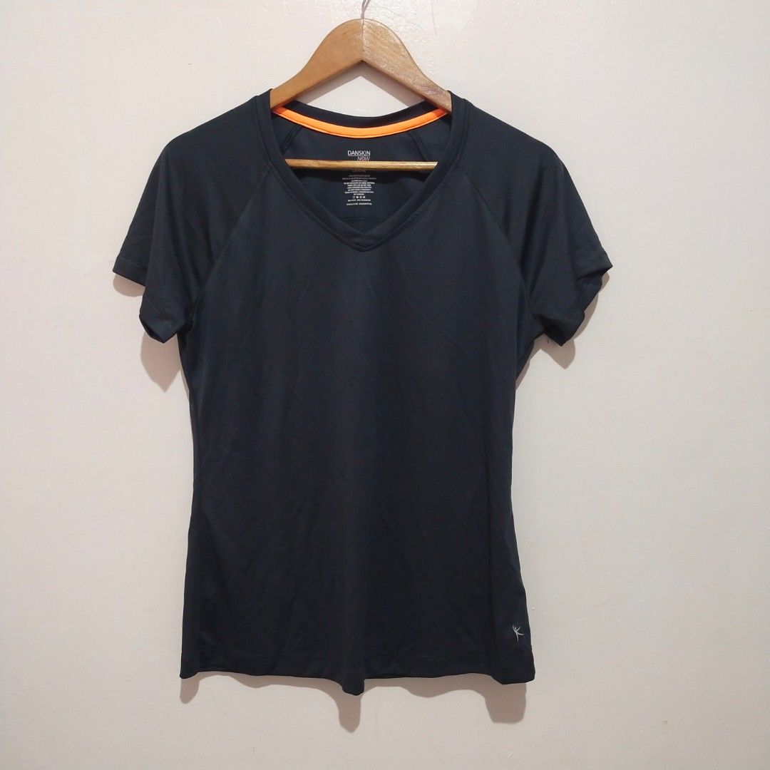 Danskin Now Black Athletic V-Neck Shirt (Category: Activewear) located in Subic. Submitted by mustardt_ (Listing ID 1461627741, Image 1). Description: Activewear V-neck top in solid dark charcoal/black with neon orange collar trim, short sleeves, and 100% polyester lightweight dry-release fabric (Size L/G 12/14) size:19in x 25in code: c728.