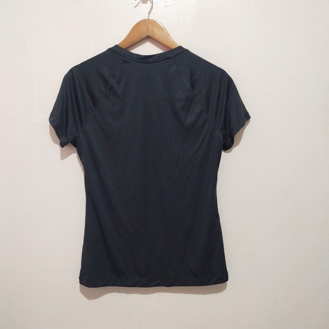 Danskin Now Black Athletic V-Neck Shirt (Category: Activewear) located in Subic. Submitted by mustardt_ (Listing ID 1461627741, Image 3). Description: Activewear V-neck top in solid dark charcoal/black with neon orange collar trim, short sleeves, and 100% polyester lightweight dry-release fabric (Size L/G 12/14) size:19in x 25in code: c728.