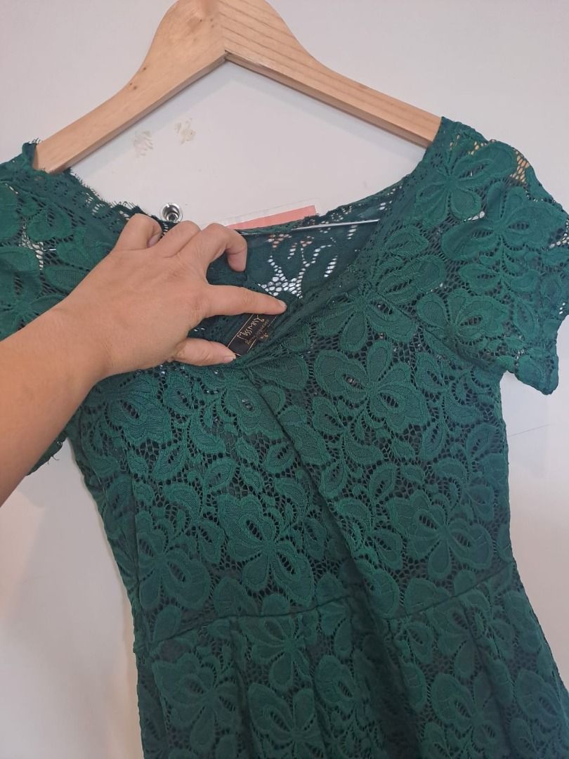 dark green lace dress (Category: Dresses) located in Mandaluyong City. Submitted by epicowl-c93c (Listing ID 1461768090, Image 3). Description: The image shows a dark green floral lace dress featuring a brand tag that reads "Missmay"..