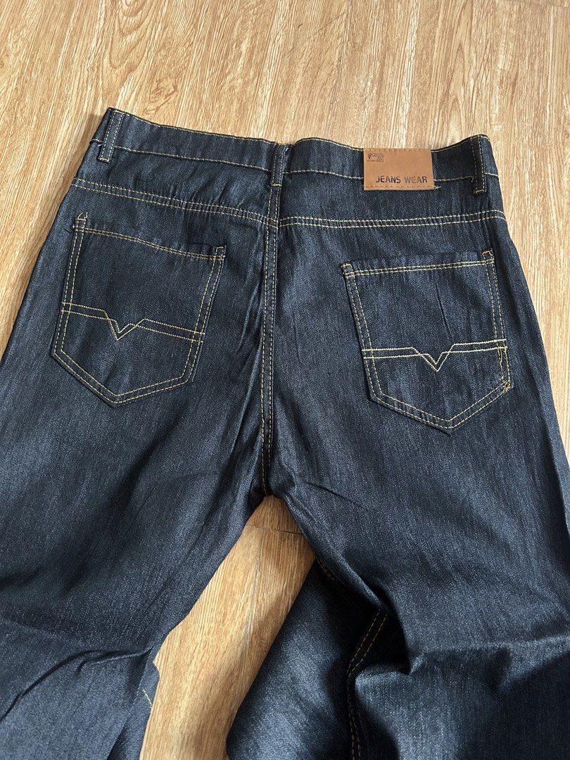 Dark Wash Denim Jeans (Category: Jeans) located in Dasmarinas. Submitted by brandedstuff.est2022 (Listing ID 1461691710, Image 1). Description: - Size: 33 inches - Style: Slim-fit - Classic dark wash denim - Straight leg fit for a timeless silhouette - Distinctive yellow stitching detail throughout - Secure button and zip fly closure - Two back pockets with stylish stitching - Comfortable and versatile for everyday wear - Ideal for creating casua