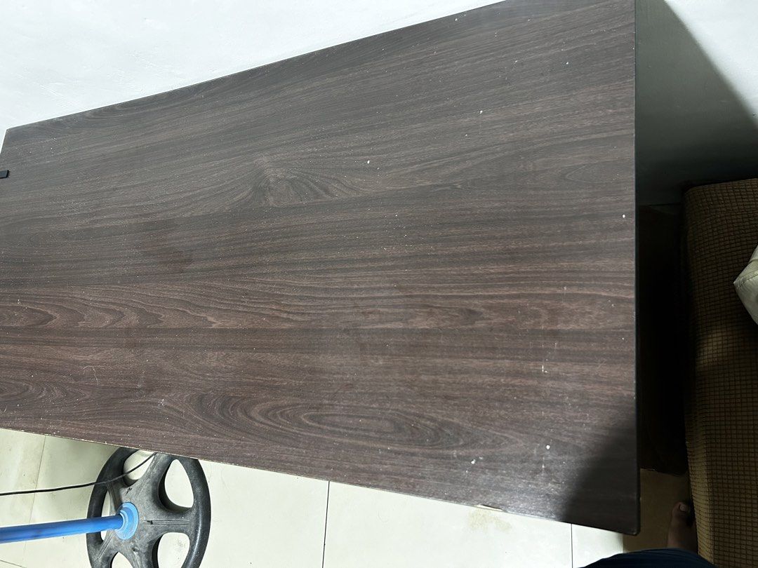 Dark Wood Study Desk with Drawers (Category: Tables & Sets) located in Caloocan City. Submitted by hansev (Listing ID 1461766274, Image 3). Description: - Dimension: L- 117cm, W-53cm, H- 72cm - Stylish dark wood finish study desk - Spacious tabletop for ample workspace - Three convenient drawers on the right side for storage - One drawer includes a lock for added security - Ideal for your home office or study room setup Issue: - Minor scuffs on t