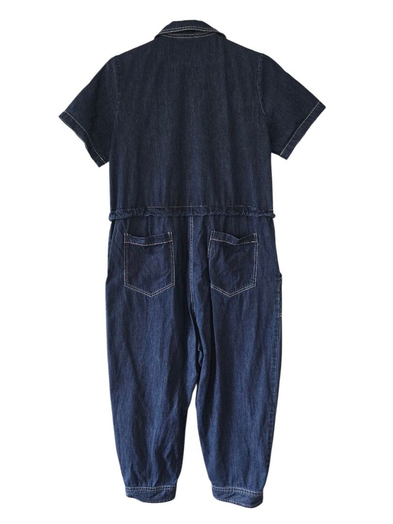 Denim Short Sleeve Jumpsuit with Drawstring Waist (Category: Jumpsuits) located in Cainta. Submitted by piper8 (Listing ID 1461578539, Image 2). Description: - Dimension (laid flat): length: 128 cm chest: 50 cm Hips: 48 cm sleeve hole: 20 cm - Dark wash denim jumpsuit - Short sleeves and collared neckline - Zip-up front closure - Elasticated drawstring waist for comfort - Two chest pockets and two hip pockets - Button details at the ankle - Ideal