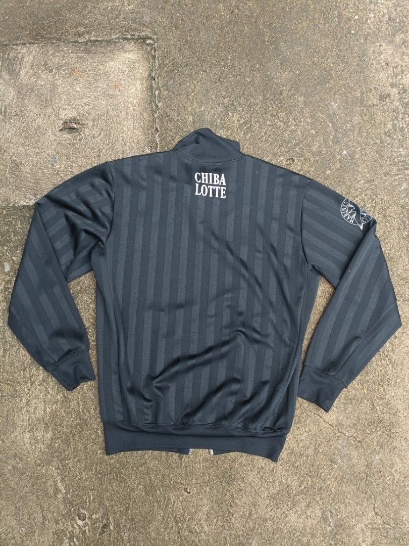 Descente Chiba Lotte Marines Track Jacket (Category: Coats, Jackets and Outerwear) located in Manila. Submitted by nobi_fd75d9 (Listing ID 1461658775, Image 2). Description: - Official Descente track jacket for the Chiba Lotte Marines. - Stylish dark grey with a subtle vertical stripe pattern. - Features a full zip front for easy wear. - Convenient pockets for your essentials. - Showcases the team logo and name, perfect for fans. - Ideal for both
