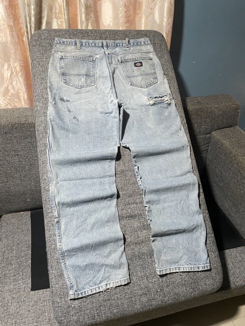 Dickies Light Wash Denim Carpenter Jeans (Category: Jeans) located in Caloocan City. Submitted by thrift.enough (Listing ID 1461743047, Image 3). Description: - Dickies light wash denim jeans - Classic carpenter style - Reinforced knees for durability - Shows some wear: rip on back pocket, marks on front - Still a sturdy pair of work pants, ready for your next project.