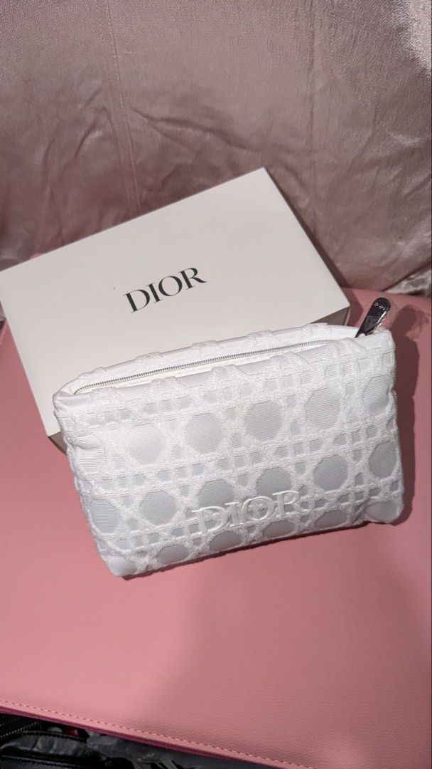 Dior White Pouch GIFTS WITH PURCHASE (Category: Luxury Bags & Wallets) located in Manila. Submitted by beeboodee (Listing ID 1461622854, Image 1). Description: - Authentic Dior White Pouch - Gift With Purchase item - Features iconic Dior pattern - Pristine white color - Ideal for makeup, toiletries, or small essentials - Sealed, brand new - Box is a bit damaged but does bot affect pouch.