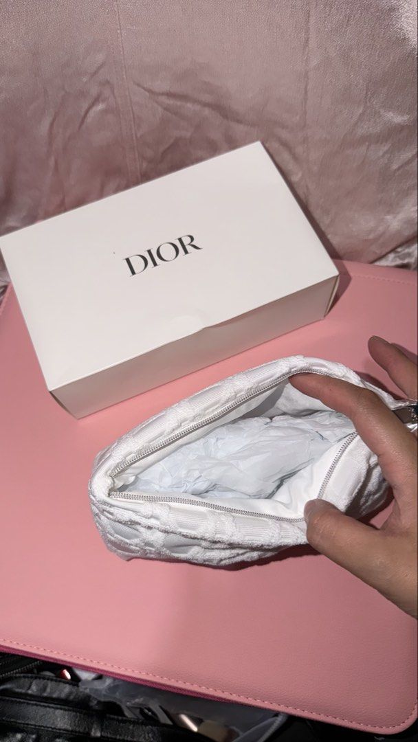 Dior White Pouch GIFTS WITH PURCHASE (Category: Luxury Bags & Wallets) located in Manila. Submitted by beeboodee (Listing ID 1461622854, Image 2). Description: - Authentic Dior White Pouch - Gift With Purchase item - Features iconic Dior pattern - Pristine white color - Ideal for makeup, toiletries, or small essentials - Sealed, brand new - Box is a bit damaged but does bot affect pouch.