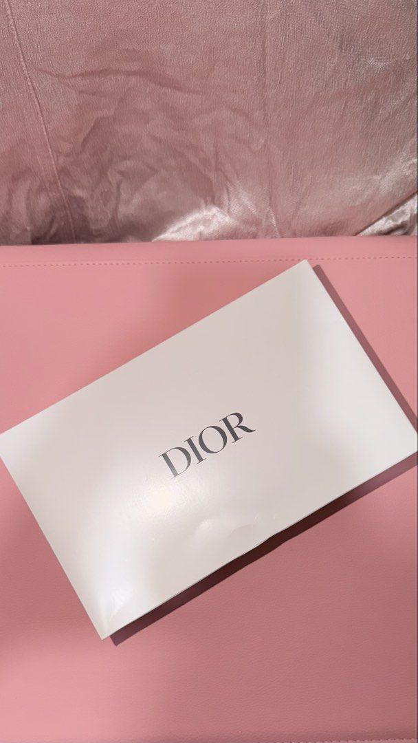 Dior White Pouch GIFTS WITH PURCHASE (Category: Luxury Bags & Wallets) located in Manila. Submitted by beeboodee (Listing ID 1461622854, Image 3). Description: - Authentic Dior White Pouch - Gift With Purchase item - Features iconic Dior pattern - Pristine white color - Ideal for makeup, toiletries, or small essentials - Sealed, brand new - Box is a bit damaged but does bot affect pouch.