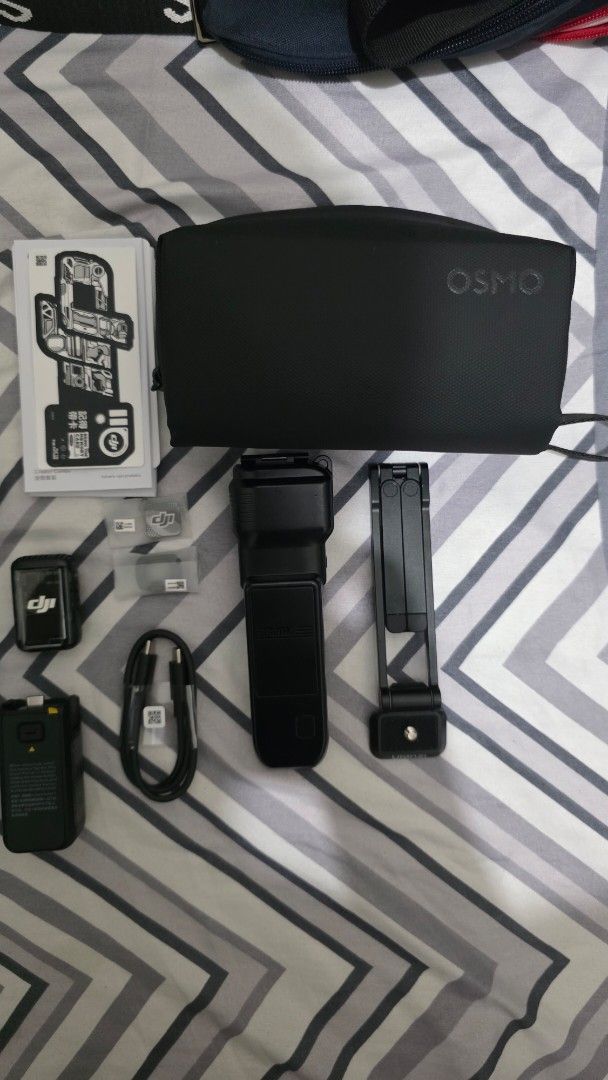 DJI Osmo Pocket 3 Creator Combo (Category: Video Cameras) located in Manila. Submitted by primos_playground (Listing ID 1461758670, Image 3). Description: - DJI Osmo Pocket 3 Creator Combo PHP 23k Negotiable - Includes: Camera, Handle with Battery Extension, Wide-Angle Lens, Microphone, Carrying Case - Also includes charging cable and other accessories shown - Ideal for vlogging and content creation - All items are good as new and in the original