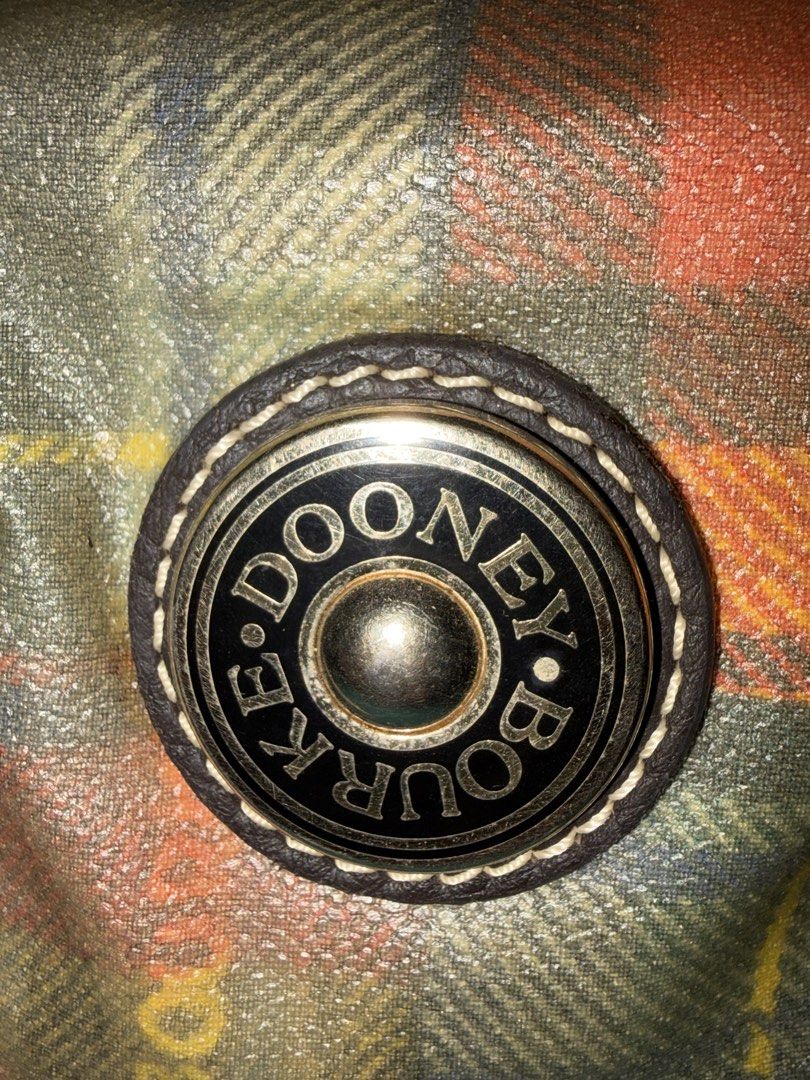 Dooney & Bourke Plaid Leather Trim Bucket Bag (Category: Luxury Bags & Wallets) located in Las Pinas. Submitted by ces0427 (Listing ID 1461675949, Image 2). Description: - Classic Dooney & Bourke bucket bag - Fun plaid pattern with leather trim - Drawstring closure - Leather details with stitching accents - Great for everyday use - Shows some signs of wear, but plenty of life left.