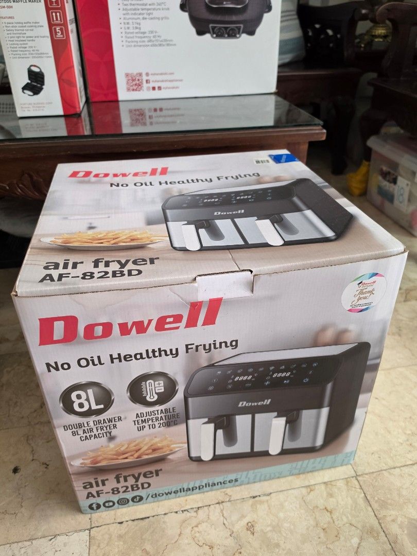 Dowell Air Fryer (Category: Fryers) located in Caloocan City. Submitted by bravemountain_ddc4bf (Listing ID 1461608951, Image 2). Description: - Brand: Dowell - Model: AF-82BD - Capacity: 8L Double Drawer - Feature: No Oil Healthy Frying - Temperature: Adjustable up to 200°C - Cooking Programs: 10 Functional Menus - Timer: 60 Minutes - Design: Removable & Easy to Clean Non-Stick Grill - Convenience: Thermal Fuse Protected, Beep Sound Indicator.