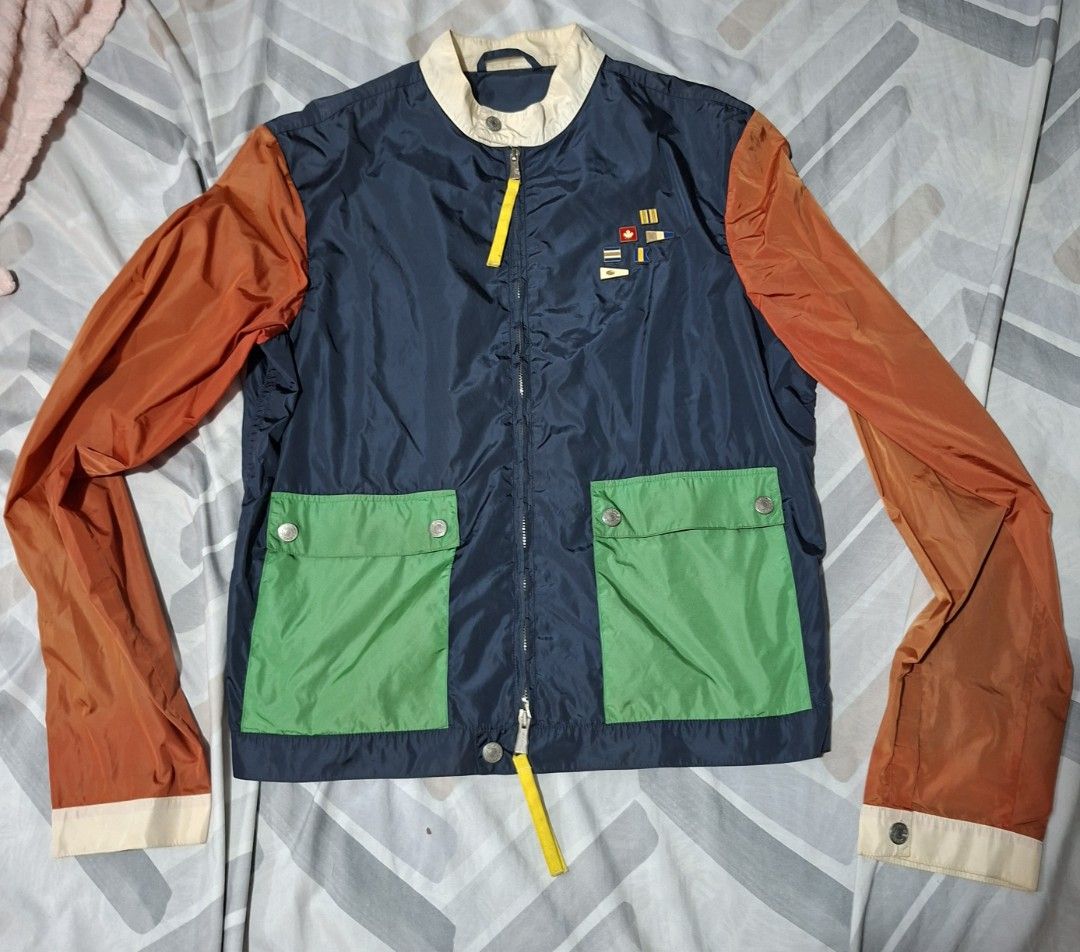 DSQUARED2 Colorblock Bomber Jacket Made in Italy (Category: Coats, Jackets and Outerwear) located in Lapu Lapu. Submitted by margaux099 (Listing ID 1461751004, Image 1). Description: - Dsquared2 jacket - Navy blue body with orange sleeves - Bright green pockets - Zip closure with yellow pull tab - Made in Italy - Size 48 - Great for layering.