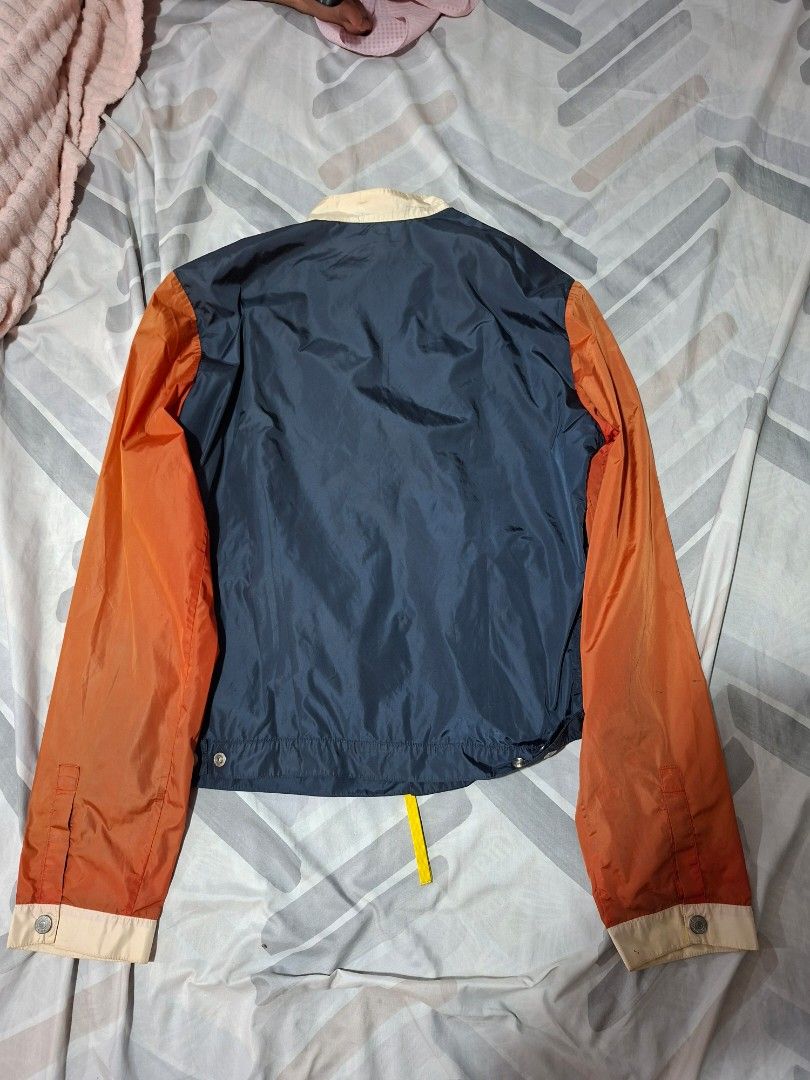 DSQUARED2 Colorblock Bomber Jacket Made in Italy (Category: Coats, Jackets and Outerwear) located in Lapu Lapu. Submitted by margaux099 (Listing ID 1461751004, Image 2). Description: - Dsquared2 jacket - Navy blue body with orange sleeves - Bright green pockets - Zip closure with yellow pull tab - Made in Italy - Size 48 - Great for layering.