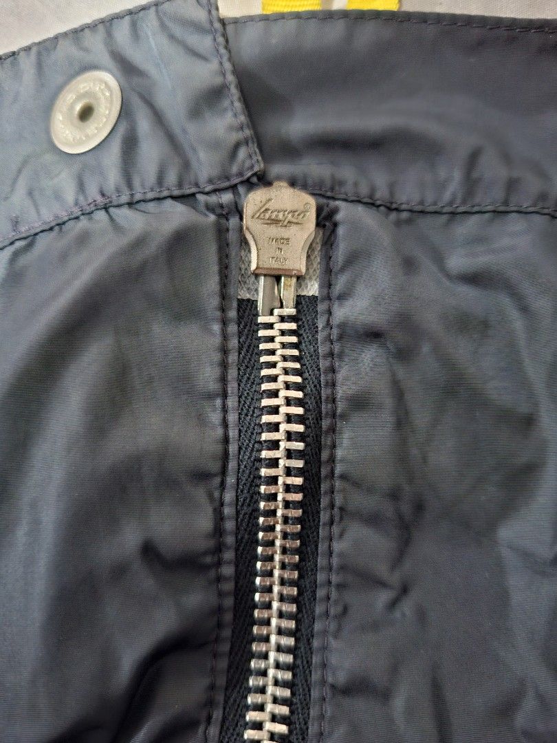 DSQUARED2 Colorblock Bomber Jacket Made in Italy (Category: Coats, Jackets and Outerwear) located in Lapu Lapu. Submitted by margaux099 (Listing ID 1461751004, Image 3). Description: - Dsquared2 jacket - Navy blue body with orange sleeves - Bright green pockets - Zip closure with yellow pull tab - Made in Italy - Size 48 - Great for layering.