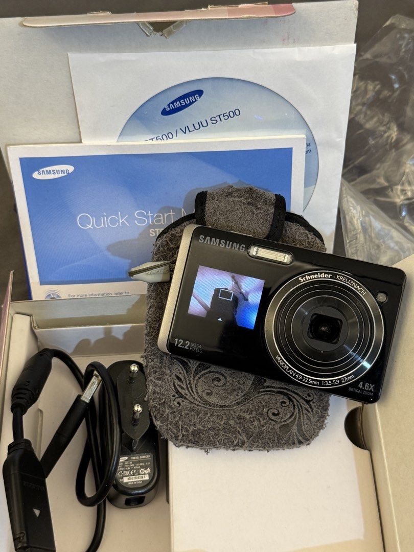 Dual-screen Digital Camera (Samsung ST500) (Category: Cameras) located in Tuguegarao City. Submitted by lex.cabulisan7 (Listing ID 1461751845, Image 2). Description: - Samsung ST500 Digital Camera - 12.2 Mega Pixels - Schneider-Kreuznach lens with 4.6x optical zoom - Includes original box, charger, pouch, and quick start guide - Perfect for capturing everyday moments with ease.