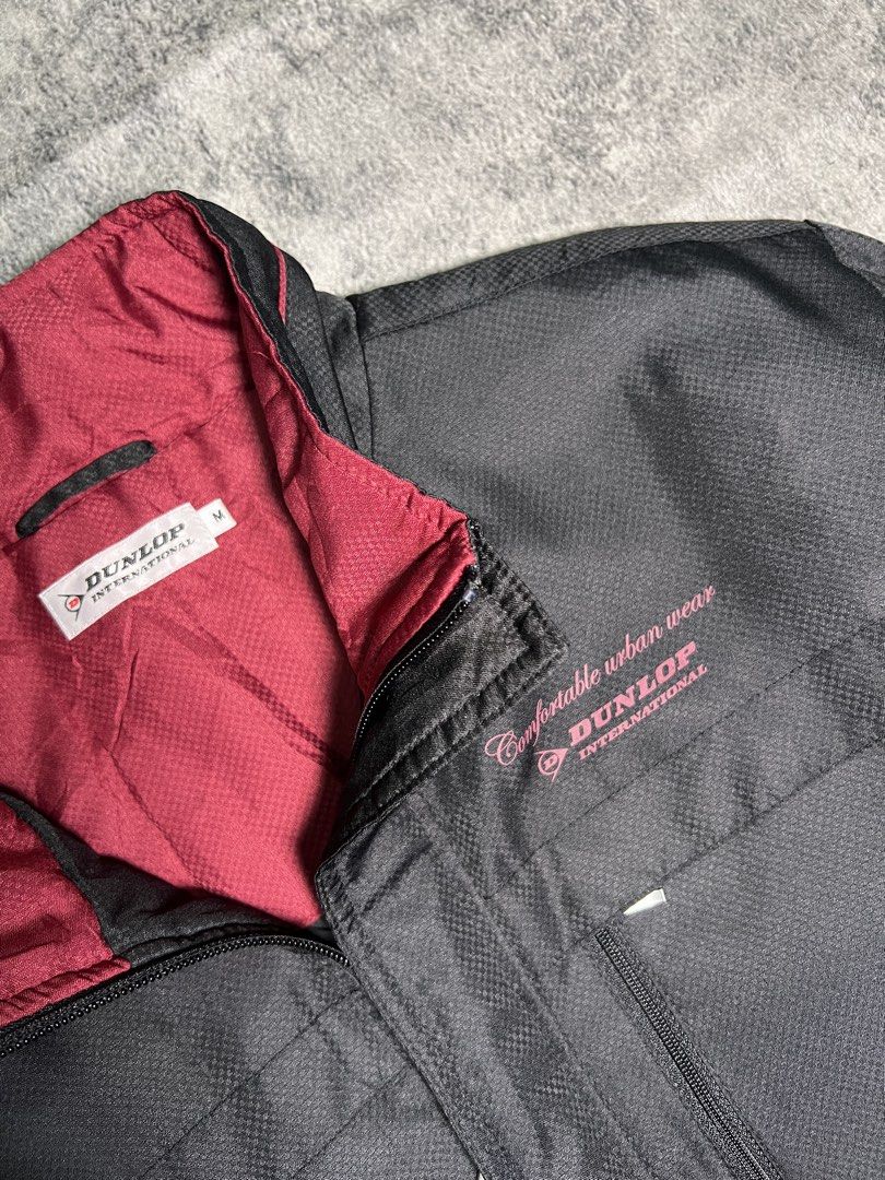 Dunlop International Black & Red Zip-Up Jacket (Category: Coats, Jackets and Outerwear) located in Manila. Submitted by 2karchive.ph (Listing ID 1461588652, Image 2). Description: DUNLOP | Medium on tag Length: 26 inch Width: 22.5 inch PHP 549 | Good condition, No Stain. PAYMENT FIRST, NO RETURN POLICY.