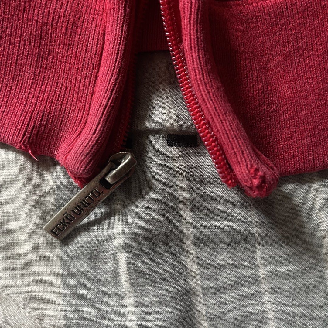 Ecko Unltd. Red Zip-Up Hoodie (Category: Hoodies) located in Manila. Submitted by deymdaniel (Listing ID 1461593457, Image 3). Description: 25 width 30 length Other side of zipper puller is missing. - Classic red Ecko Unltd. zip-up hoodie - Features iconic rhino logo on the front - "ECKO UNLTD." text on the sleeves - Size: XL - Made in China - Perfect for casual wear.