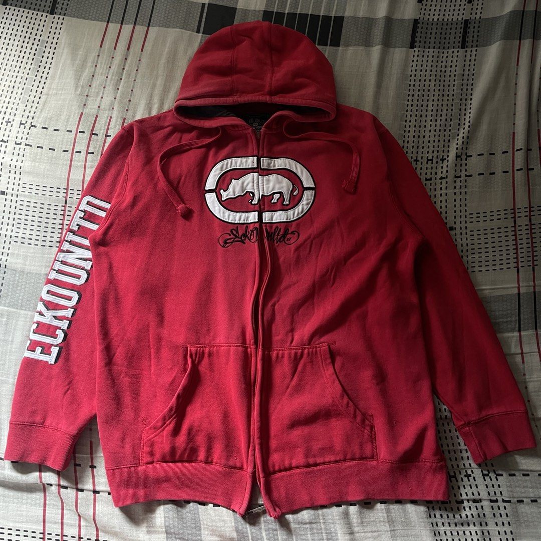 Ecko Unltd. Red Zip-Up Hoodie (Category: Hoodies) located in Manila. Submitted by deymdaniel (Listing ID 1461593457, Image 1). Description: 25 width 30 length Other side of zipper puller is missing. - Classic red Ecko Unltd. zip-up hoodie - Features iconic rhino logo on the front - "ECKO UNLTD." text on the sleeves - Size: XL - Made in China - Perfect for casual wear.