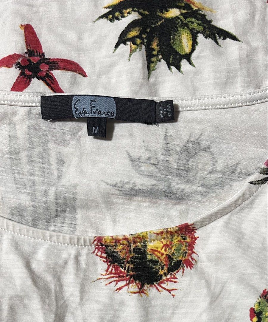 EVA FRASCO (Category: Blouses) located in Davao. Submitted by sart0ria85 (Listing ID 1461710488, Image 2). Description: An off white blouse with cactus and floral prints. 95%COTTON 5%SPANDEX MADE IN CHINA 🇨🇳 MEDIUM. Size 6 VERY GOOD CONDITION (89/100).