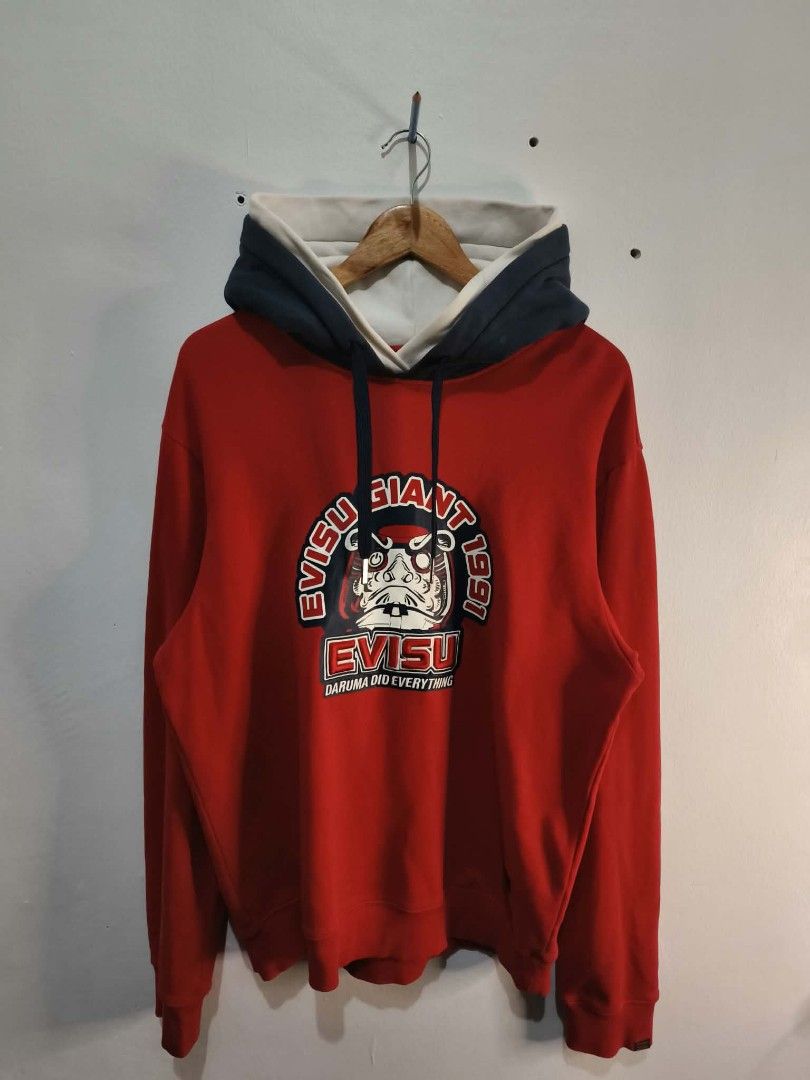 Evisu Giant Red Hoodie XL (Category: Coats, Jackets and Outerwear) located in Manila. Submitted by temetrius_husslin (Listing ID 1461744044, Image 1). Description: - Authentic Evisu Giant Hoodie - Size: XL - Bold graphic print on the front - Contrasting navy and white hood lining.