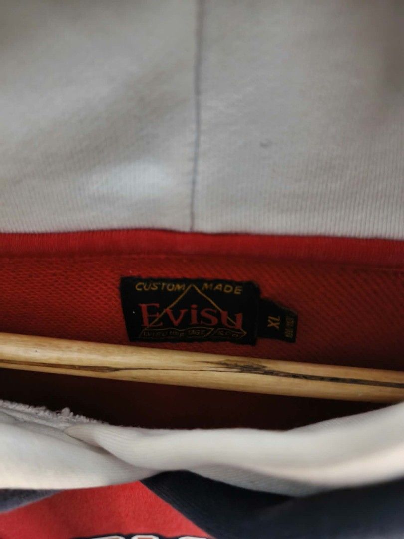 Evisu Giant Red Hoodie XL (Category: Coats, Jackets and Outerwear) located in Manila. Submitted by temetrius_husslin (Listing ID 1461744044, Image 2). Description: - Authentic Evisu Giant Hoodie - Size: XL - Bold graphic print on the front - Contrasting navy and white hood lining.