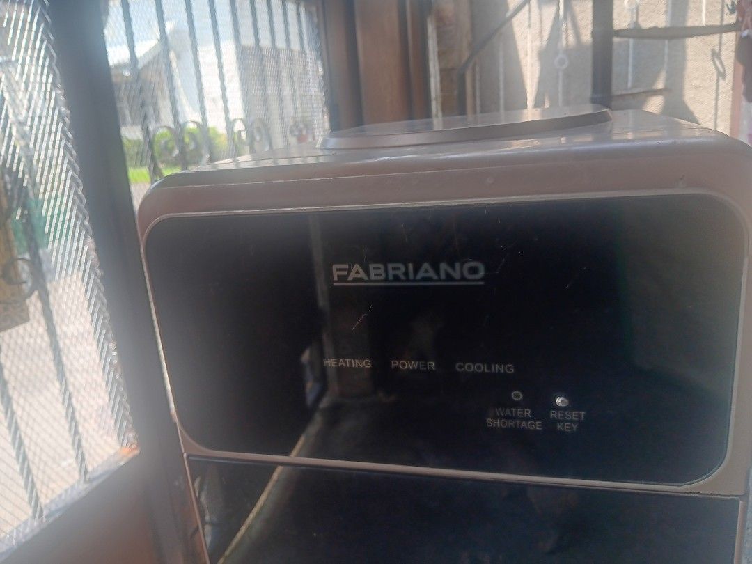 Fabriano Water Dispenser Hot Cold (needs repair) (Category: Water Purifiers & Dispensers) located in Las Pinas. Submitted by jesus1smysavi0r (Listing ID 1461622157, Image 3). Description: Needs to be checked- water not flowing, don't have time to troubleshoot - Fabriano Water Dispenser - Hot and Cold water options - Indicator lights for heating, power, and cooling - Water shortage indicator and reset key - Dispenser taps located at the bottom - S