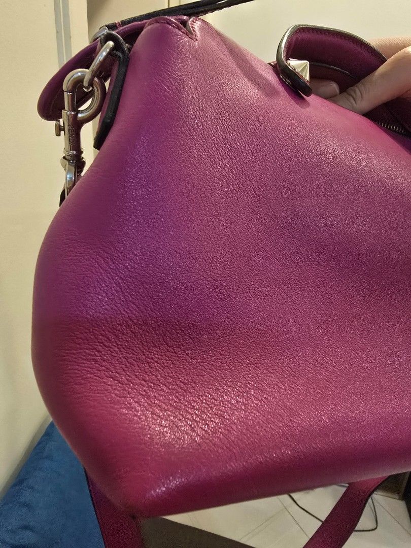 Fendi by the way (Category: Luxury Bags & Wallets) located in Manila. Submitted by CLLcloset (Listing ID 1461691787, Image 3). Description: - Authentic Fendi bag in vibrant pink - Genuine leather material - Fendi logo on zipper pull - Top handle and detachable shoulder strap - Spacious interior for essentials - Stylish accessory for any occasion.