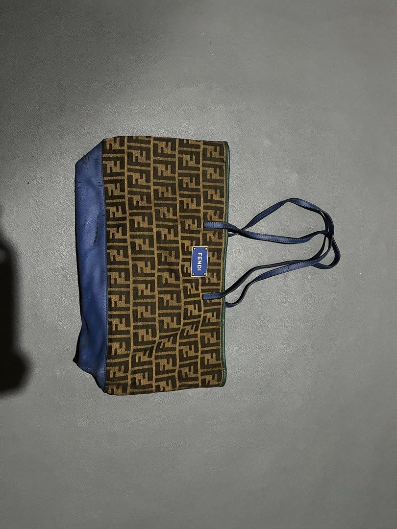 Fendi Zucca Canvas & Leather Tote Bag (Category: Tote Bags) located in General Santos City (Dadiangas). Submitted by thiftnibadi3 (Listing ID 1461694059, Image 1). Description: - Authentic Fendi tote bag - Classic Zucca canvas with blue leather accents - Interior zip closure - Made in Italy - Shows some signs of wear on leather trim and base (consistent with age/use) - Perfect everyday bag.