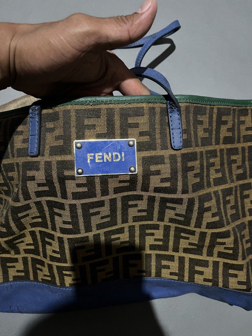 Fendi Zucca Canvas & Leather Tote Bag (Category: Tote Bags) located in General Santos City (Dadiangas). Submitted by thiftnibadi3 (Listing ID 1461694059, Image 3). Description: - Authentic Fendi tote bag - Classic Zucca canvas with blue leather accents - Interior zip closure - Made in Italy - Shows some signs of wear on leather trim and base (consistent with age/use) - Perfect everyday bag.