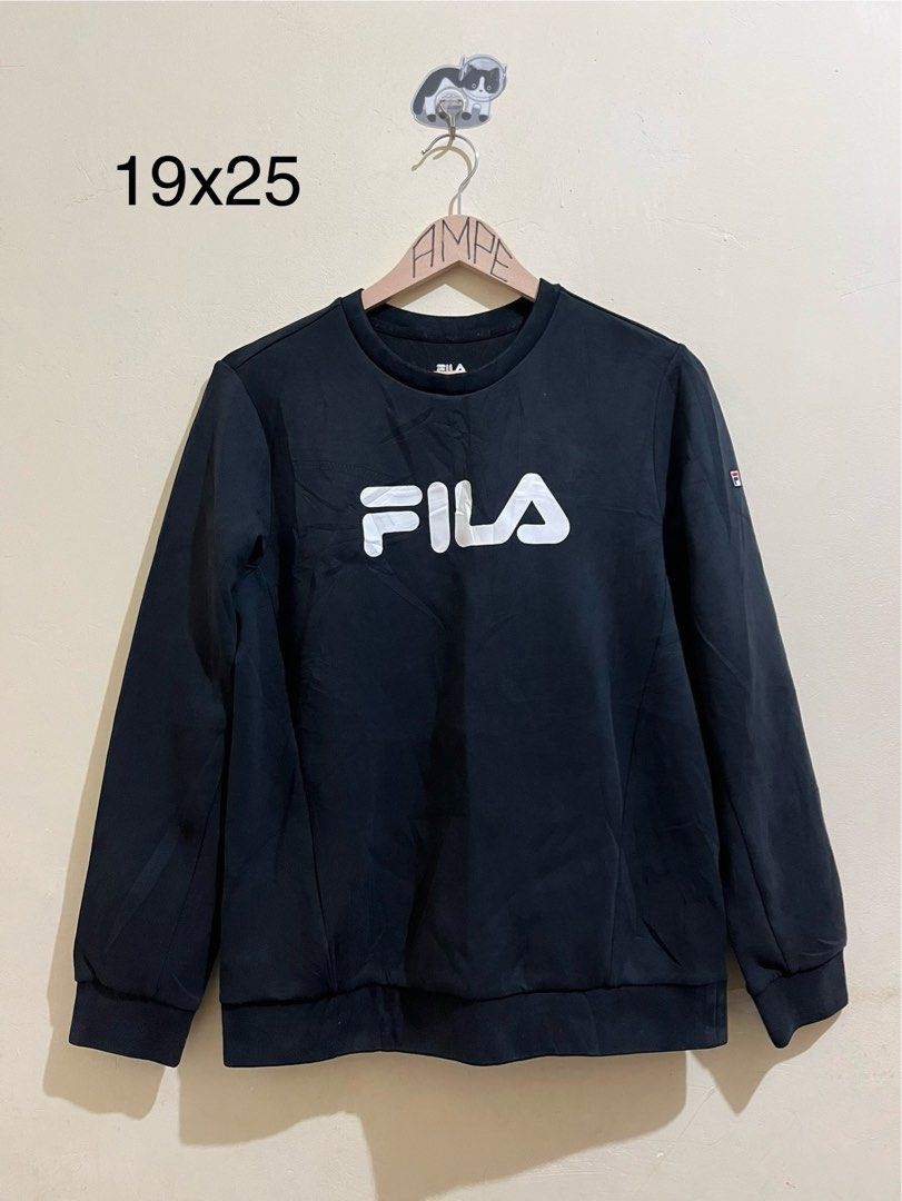Fila Black Crewneck Sweatshirt (Category: Coats, Jackets and Outerwear) located in Manila. Submitted by juspheroca82034 (Listing ID 1461685776, Image 1). Description: - Classic black Fila sweatshirt - Iconic white Fila logo across chest - Long sleeves with ribbed cuffs and hem - Ideal for casual wear - Pairs easily with jeans or joggers - Comfortable and stylish.