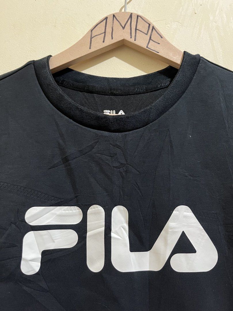 Fila Black Crewneck Sweatshirt (Category: Coats, Jackets and Outerwear) located in Manila. Submitted by juspheroca82034 (Listing ID 1461685776, Image 3). Description: - Classic black Fila sweatshirt - Iconic white Fila logo across chest - Long sleeves with ribbed cuffs and hem - Ideal for casual wear - Pairs easily with jeans or joggers - Comfortable and stylish.