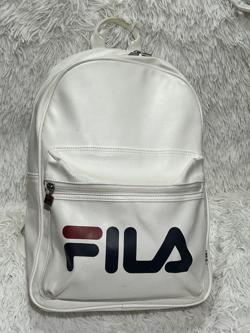 Fila White Backpack (Category: Backpacks) located in Pasig City. Submitted by minminreyn (Listing ID 1461732754, Image 1). Description: Fila Backpack With etiketa Minimal rubs Pinaka issue medyo Marumi color white kasi saka may maliit na guhit ng pentelpen ikaw nalang mag pa Dry clean .