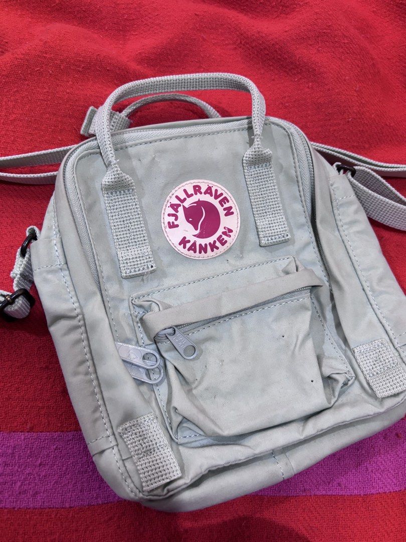 Fjallraven Kanken Mini Backpack in Mint Green (Category: Backpacks) located in Manila. Submitted by jellyycrd (Listing ID 1461664632, Image 1). Description: • Mint green • Features a main zippered compartment, a quick-access front pocket, and a secure rear pocket for a phone or small tablet. • Can fit kindle • Adjustable straps • Needs light cleaning RFS: De-cluttering/not using anymore .