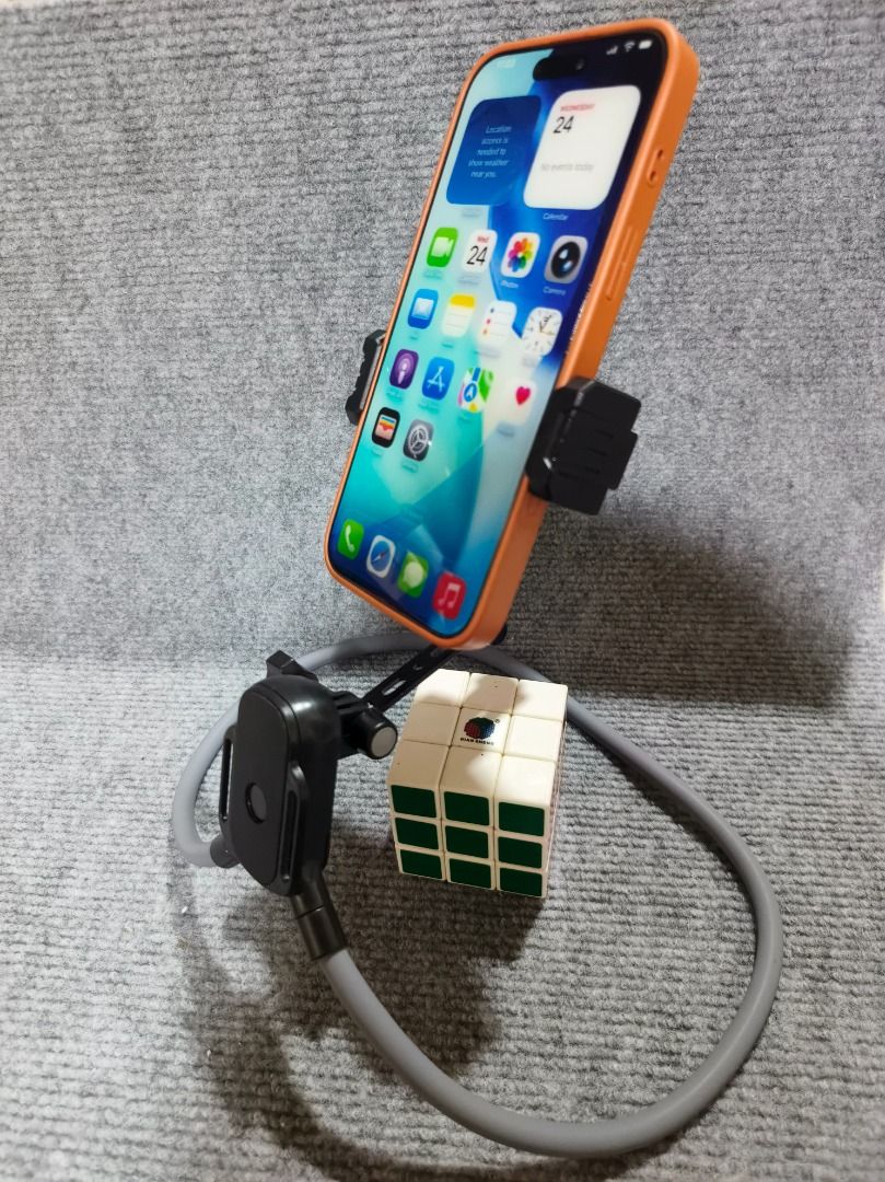 Flexible Neck-Hang Lazy Phone Mount & Desktop Stand (Category: Mounts & Holders) located in San Leonardo. Submitted by burgossanleonardo.12345 (Listing ID 1461707259, Image 2). Description: Mount Type: Spring-loaded side clamp.Material: Flexible alloy core, padded foam sleeve, and durable ABS plastic.Compatibility: Fits most standard smartphones (including iPhones and Android devices with protective cases).Color: Sleek Black mount with a minimali