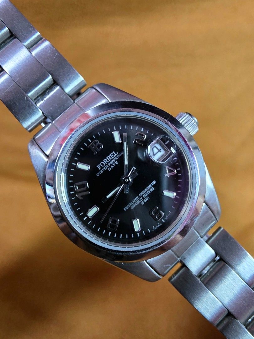 Forbel Oyster Perpetual Date Watch (Category: Luxury Watches) located in Rosales. Submitted by akumie30 (Listing ID 1461716567, Image 2). Description: - Forbel Swiss Watch - Black Dial with Date Window at 3 o'clock - Stainless Steel Case and Bracelet - Water Resistant up to 10 ATM - Made in Japan - QC Passed All Original Watch Working Properly Watch Only Hindi po kasama ang Box Cas Size 25mm, 28.5mm with Crown Screw Down Crown Wrist Size 16.5cm.