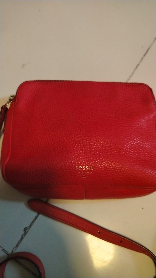 Fossil Red Leather Crossbody Bag (Category: Cross-body Bags) located in Manila. Submitted by wildwind_73f77a (Listing ID 1461570346, Image 3). Description: - Fossil red pebbled leather crossbody bag - Two zippered compartments for secure storage - Elegant gold hardware details - Adjustable strap for comfortable wear - Versatile for everyday use or a night out - Spacious interior for your essentials.