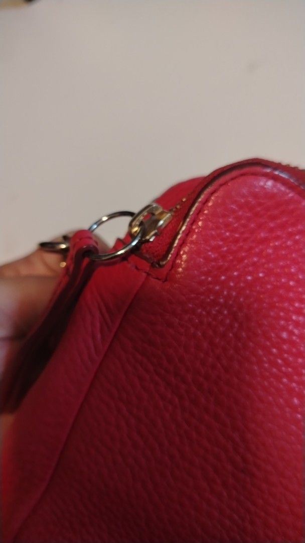Fossil Red Leather Crossbody Bag (Category: Cross-body Bags) located in Manila. Submitted by wildwind_73f77a (Listing ID 1461570346, Image 2). Description: - Fossil red pebbled leather crossbody bag - Two zippered compartments for secure storage - Elegant gold hardware details - Adjustable strap for comfortable wear - Versatile for everyday use or a night out - Spacious interior for your essentials.