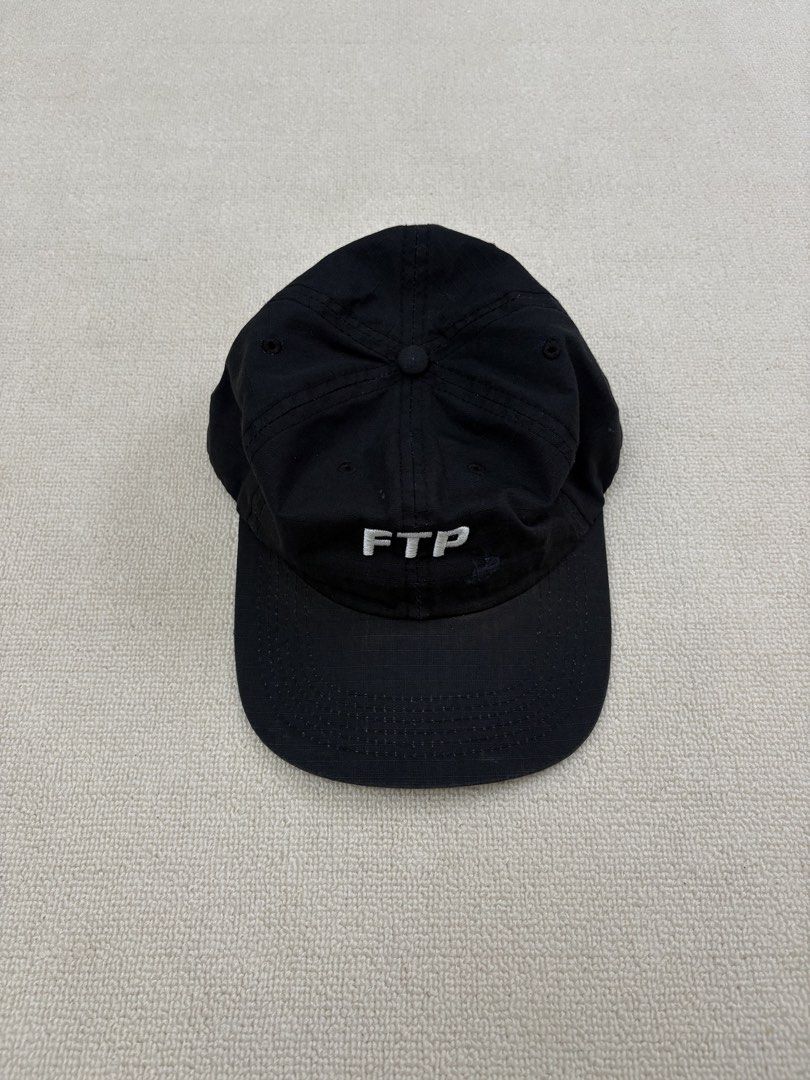 FTP "Fuck The Population" Black Baseball Cap (Category: Caps & Hats) located in Manila. Submitted by porma.market (Listing ID 1461577940, Image 2). Description: - Classic black FTP baseball cap - Embroidered 'FTP' logo on the front - 'Fuck The Population' text embroidered on the back - Adjustable strap for a custom fit - Perfect for everyday wear.