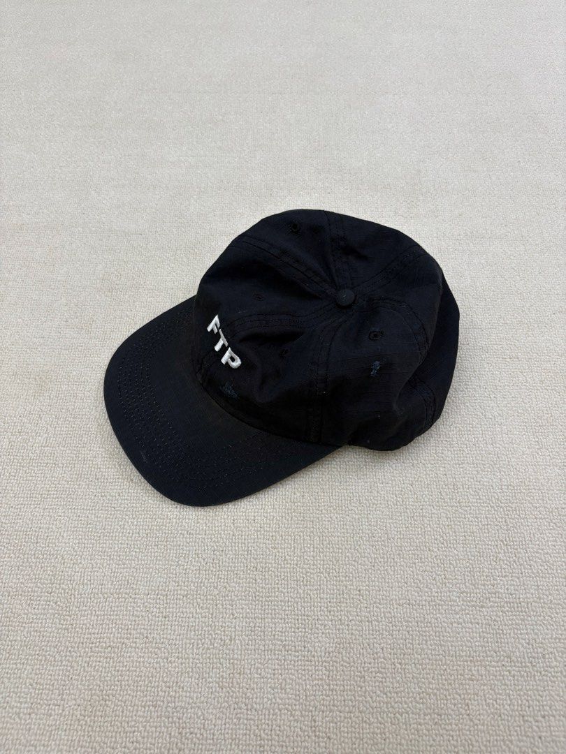 FTP "Fuck The Population" Black Baseball Cap (Category: Caps & Hats) located in Manila. Submitted by porma.market (Listing ID 1461577940, Image 3). Description: - Classic black FTP baseball cap - Embroidered 'FTP' logo on the front - 'Fuck The Population' text embroidered on the back - Adjustable strap for a custom fit - Perfect for everyday wear.