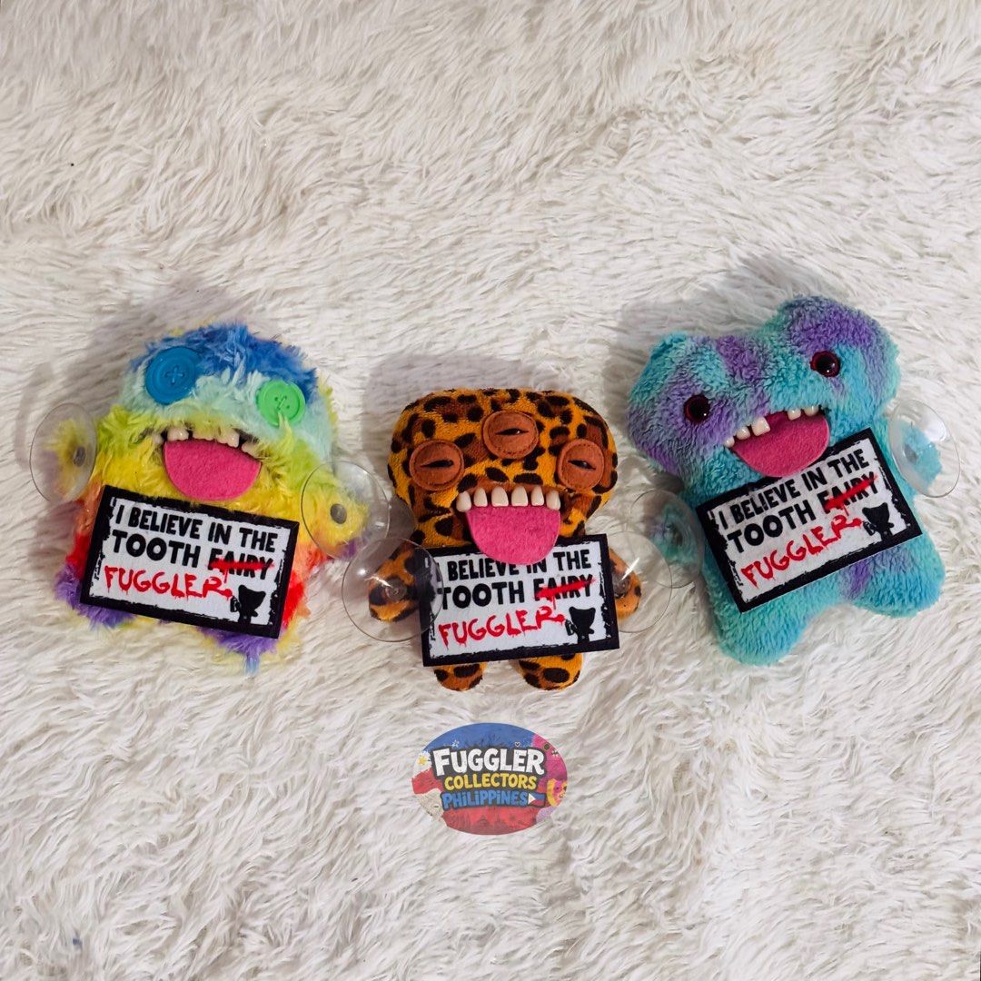 Fuggler Window Clingers (Category: Vintage Collectibles) located in Caloocan City. Submitted by raeccas.selections (Listing ID 1461657052, Image 1). Description: Give your car windows, mirrors, and glass doors a little dose of creepy-cuteee chaos! 🦷🩵 - cut tags, but still hard to find! - rare pieces ✨ Prices: Oogah Boogah: ₱1,499 Annoyed Alien: ₱1,899 (rare!) Gaptooth: ₱1,799 Whole set: ₱4,999 Grab your favorite before they cling away! 👀 Locat
