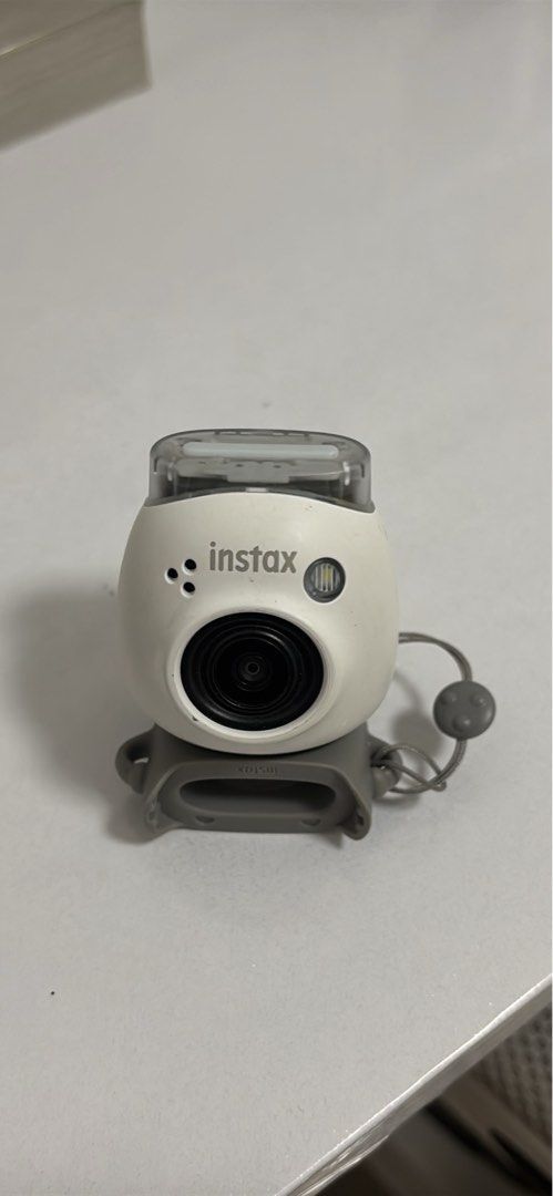 Fujifilm Instax Mini PAL (Category: Cameras) located in Manila. Submitted by quannetum (Listing ID 1461617511, Image 1). Description: - Fujifilm Instax Mini PAL Camera - Color: White - Includes: Original strap and box - Condition: Good, works perfectly - Perfect for: Capturing memories.