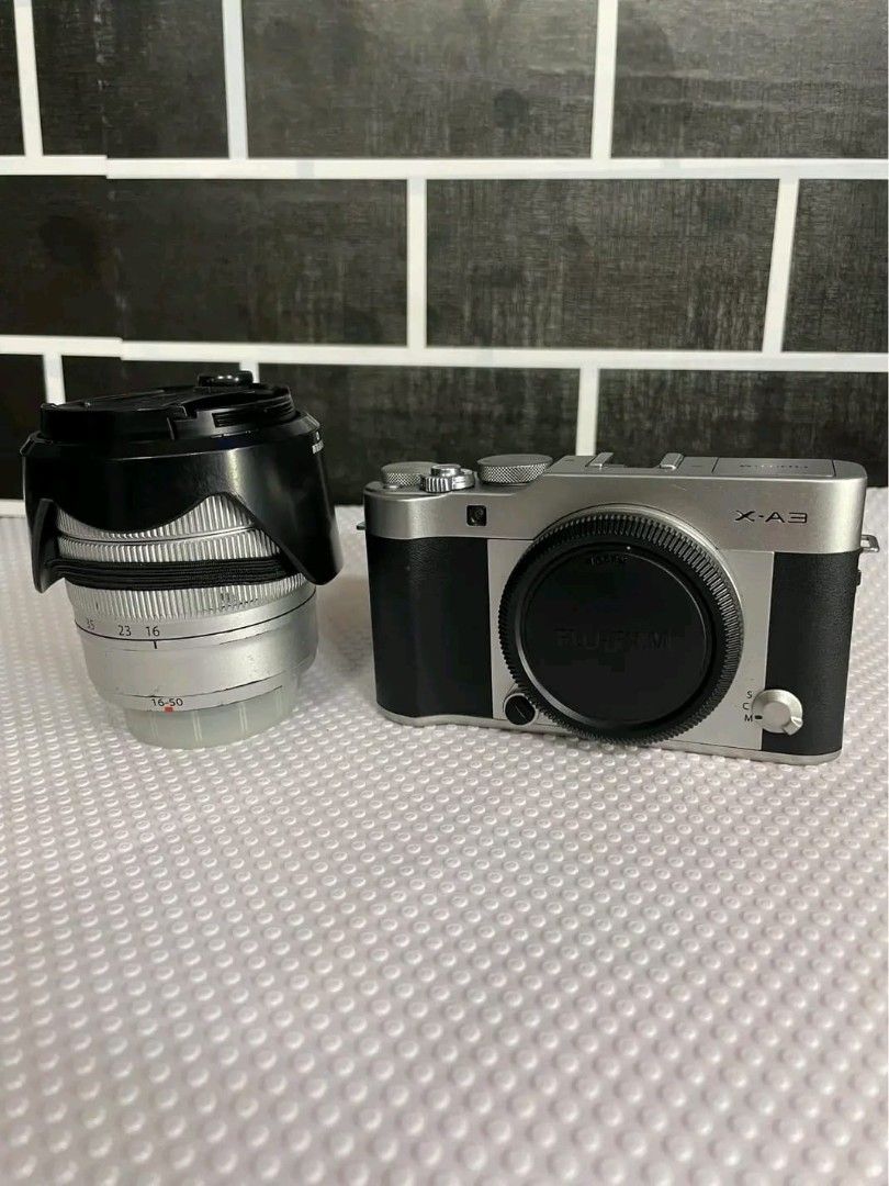 FUJIFILM (XA3) (Category: Cameras) located in Quezon City. Submitted by slapshock22 (Listing ID 1461792934, Image 3). Description: 📸 Fujifilm X-A3 — For Sale ✅ Fujifilm X-A3 — Mirrorless Camera ✅ 24.2MP APS-C Sensor — crisp, vibrant photos ✅ Classic brown & silver body — lightweight, easy to carry ✅ Built-in WiFi — share photos instantly ✅ Great colors straight from camera — perfect for portraits, travel, daily shots ✅ Comes with lens, battery, 