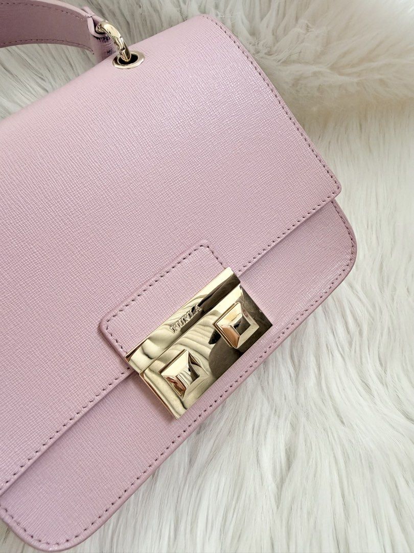 Furla Metropolis Mini Bag Pink (Category: Luxury Bags & Wallets) located in Cainta. Submitted by mskath__ (Listing ID 1461642813, Image 3). Description: - Cute Furla Metropolis mini bag - Gold hardware clasp closure - Top handle for carrying, with removable chain strap - Interior has a small pocket (with minor dirt) - Comes with dust bag, tag and booklet.