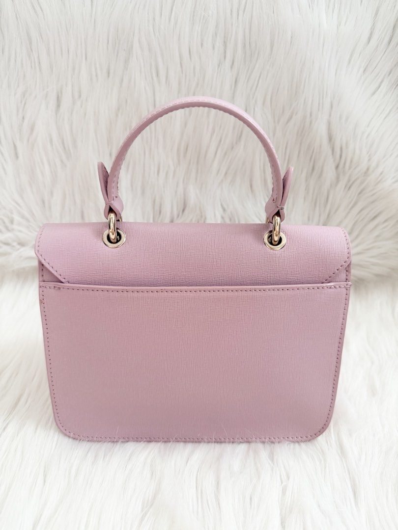 Furla Metropolis Mini Bag Pink (Category: Luxury Bags & Wallets) located in Cainta. Submitted by mskath__ (Listing ID 1461642813, Image 2). Description: - Cute Furla Metropolis mini bag - Gold hardware clasp closure - Top handle for carrying, with removable chain strap - Interior has a small pocket (with minor dirt) - Comes with dust bag, tag and booklet.