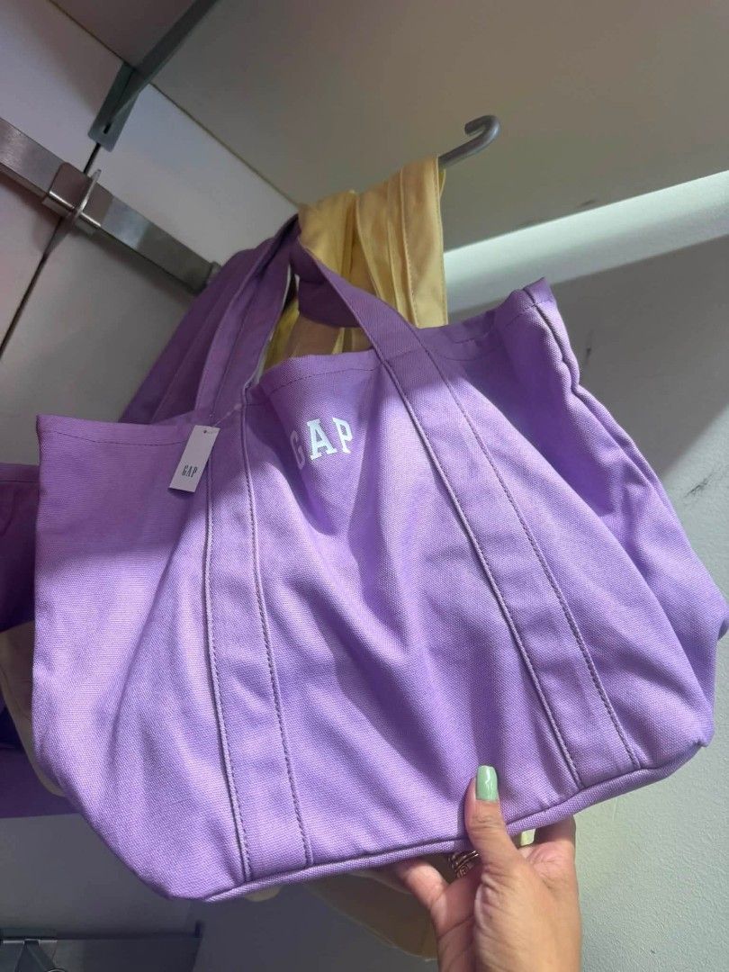 GAP Canvas Tote Bag - Various Colors Available (Category: Tote Bags) located in Manila. Submitted by assylla_ean (Listing ID 1461630678, Image 2). Description: - Cute GAP canvas tote bags - Available colors: Light Yellow, Lavender, Light Blue - Features embroidered GAP logo on the front - Made of sturdy canvas material - Perfect for everyday use - Spacious interior for essentials - Limited availability, get yours now!.
