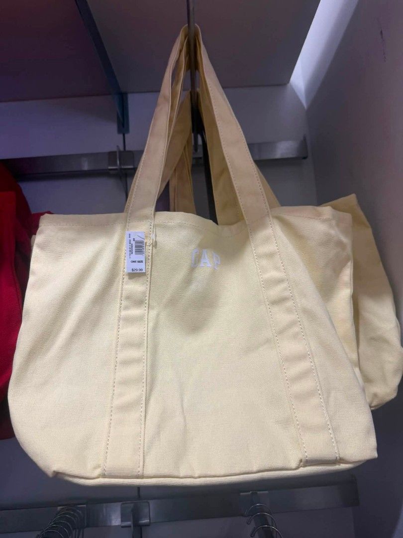 GAP Canvas Tote Bag - Various Colors Available (Category: Tote Bags) located in Manila. Submitted by assylla_ean (Listing ID 1461630678, Image 1). Description: - Cute GAP canvas tote bags - Available colors: Light Yellow, Lavender, Light Blue - Features embroidered GAP logo on the front - Made of sturdy canvas material - Perfect for everyday use - Spacious interior for essentials - Limited availability, get yours now!.